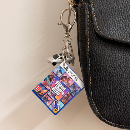 Here We Go Again, close-up of the mini Grand Theft Auto VI PS5 game case charm and silver car