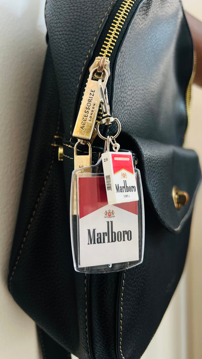 Marlboro acrylic pack keychain with a mini pack charm on a bag